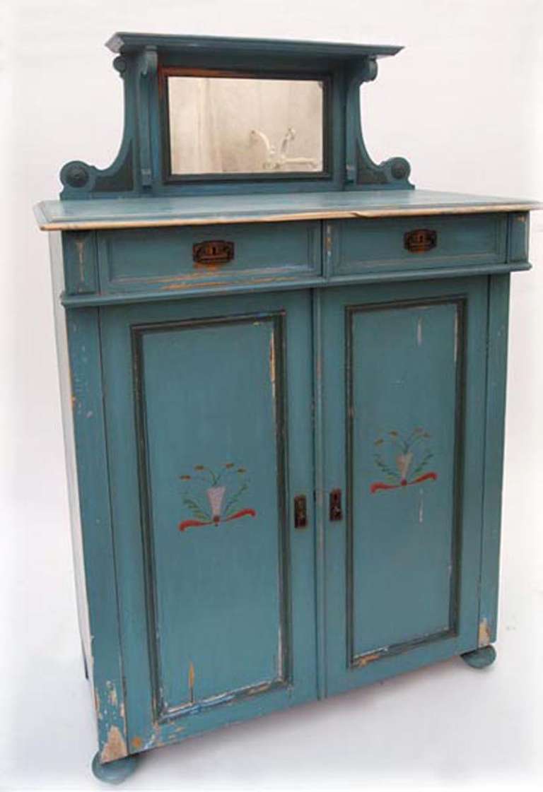 Painted cabinet with vanity mirror, early part of 1900s. Two drawers and cabinet space with shelves. Worn off paint around corners and feet, natural aged patina.
