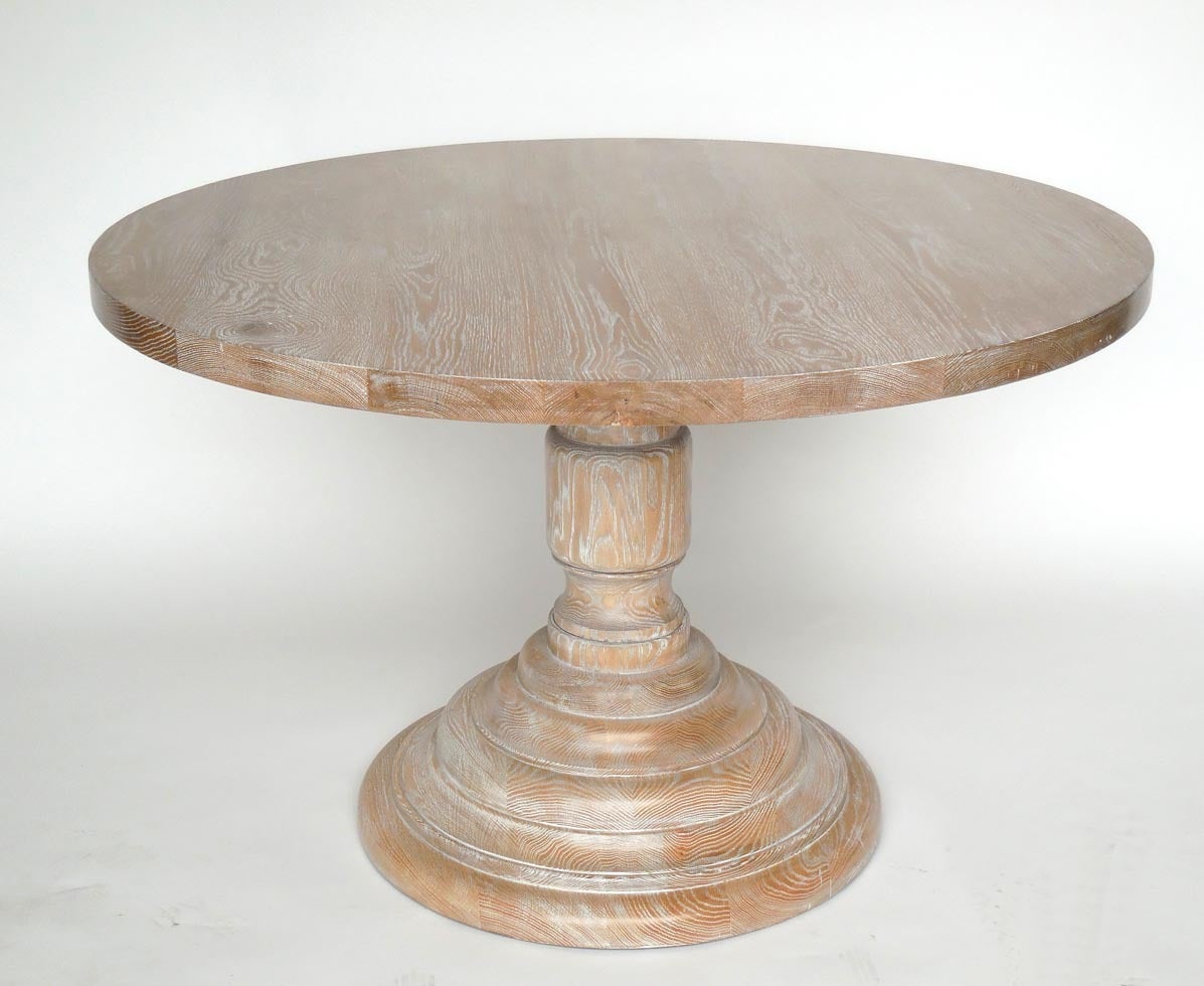 Beautiful dainty walnut pedestal table in a light wood and white ceruse finish.