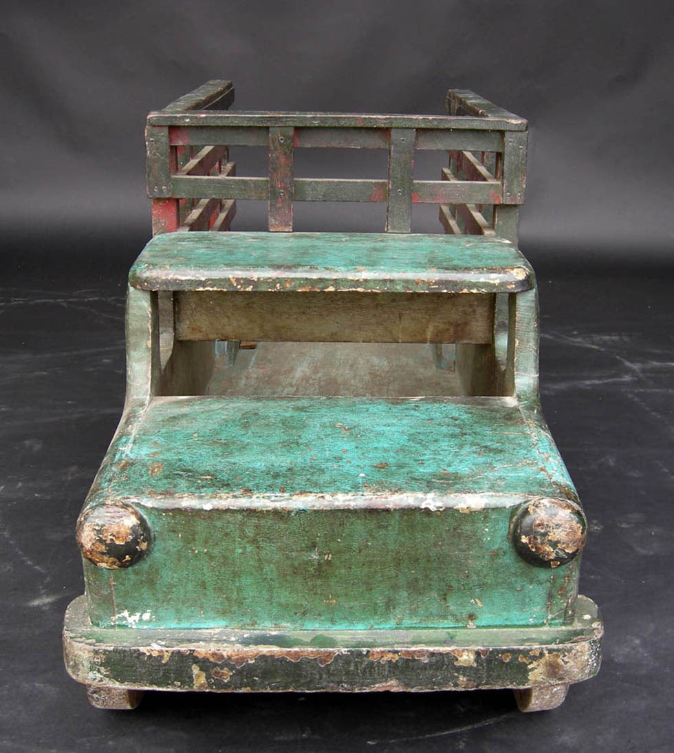 Large children's wooden toy truck in painted wood. Great piece of Folk Art. Makes a perfect Primitive wood storage piece for your fireplace.