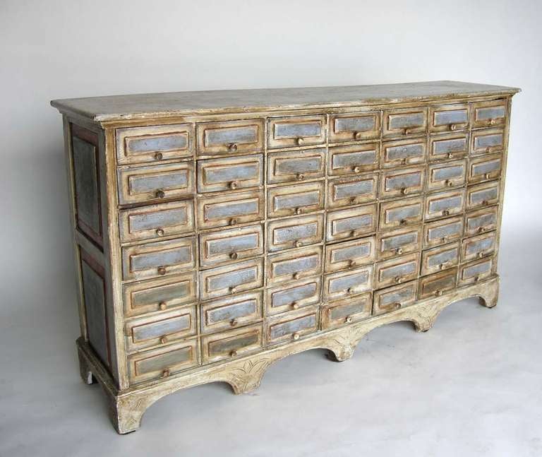 Painted multi drawer apothecary chest console. Nice narrow dimension. Unique painted finish.
