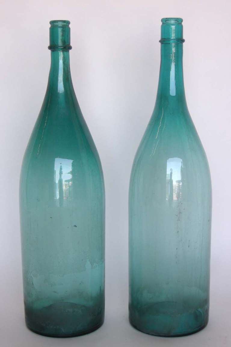 Pair of very large glass sake bottles. Great aqua color. Can be sold separately, $570 each.