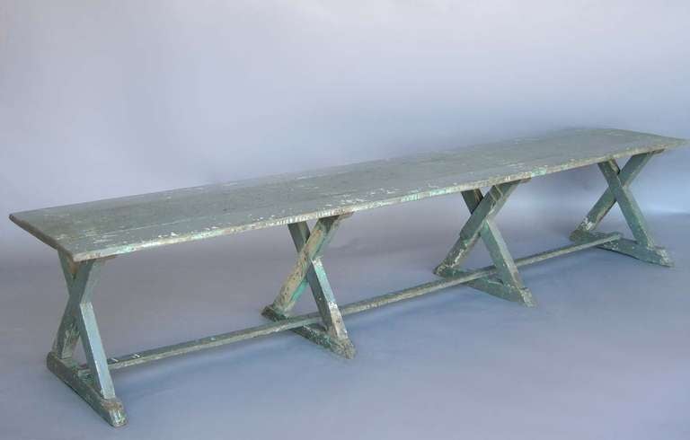 19th c.  x base bench with layers of old original paints. Great patina.