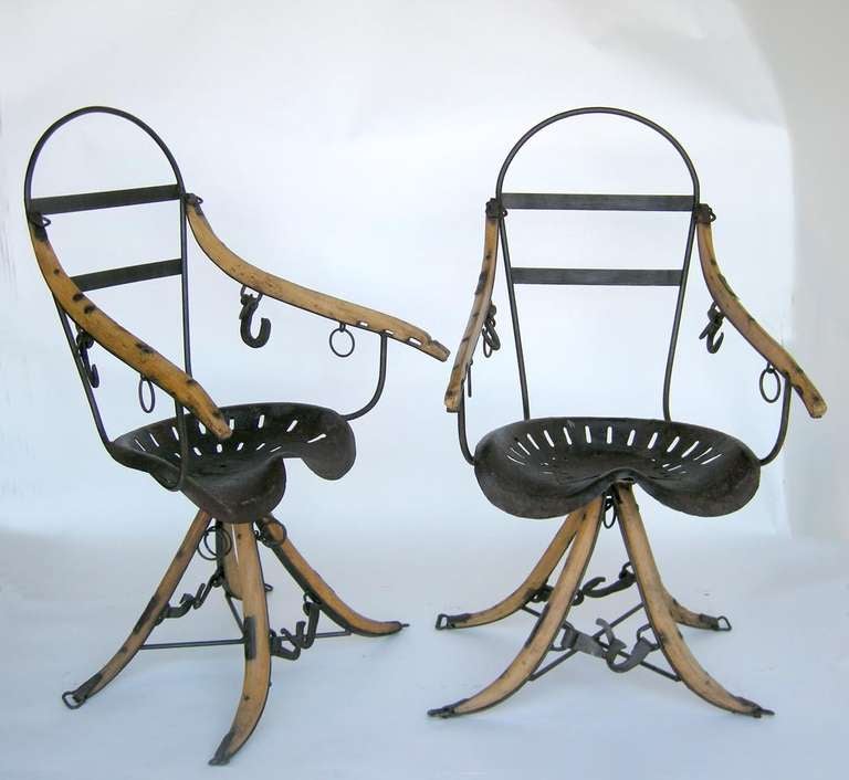 Two mid 20th century chairs made from antique tractor seats and other farm accessories. Great patina on all pieces! 
