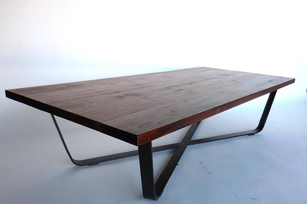 Simple oiled teak top on hand-forged iron ribbon base. Can be made in custom sizes and with custom wood tops in different finishes etc. By Dos Gallos Studio.
CUSTOM PRICES ARE SUBJECT TO CHANGE. PLEASE INQUIRE BEFORE PLACING AN ORDER. CUSTOM ORDERS