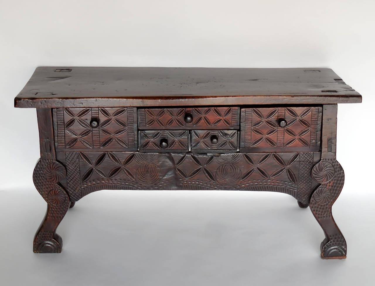 Antique Nahuala - animal spirit - table with five drawers from the highlands of Guatemala. Mortise and tenon construction. Hand-carved, beautiful patina, one wide board top. Carved rustic animal legs in front and turned legs in back. Piece of Folk
