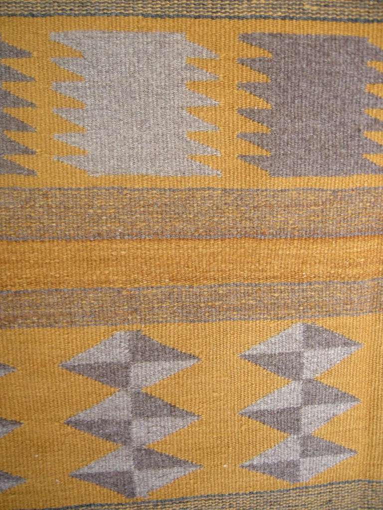 1980s Navajo rug in mustard and grey tones. Can be used as wall hanging on or the floor.