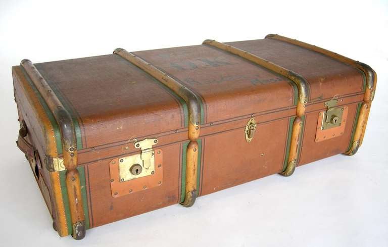 1920 - 1930s canvas, bent wood and brass luggage. Inside is clad in green linen. All original. Shipping tags showing journey from Germany to Boston via London. Initials O.K