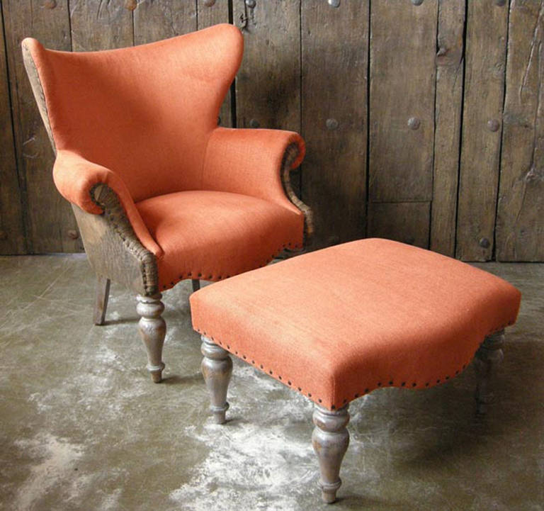 Very comfortable club chair and ottoman in orange wool and lamb's leather. Custom in designer's own material. Please inquire for pricing for ottoman and chair separately.