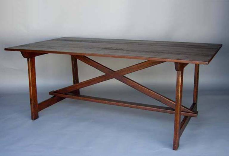 Custom walnut dining table or desk with X-stretchers. Narrow profile. 1inch thick top. Can be made in walnut, oak or mahogany in a range of finishes. Shown here in a medium walnut with a medium to heavy distress.
Made by Dos Gallos Studio, in Los