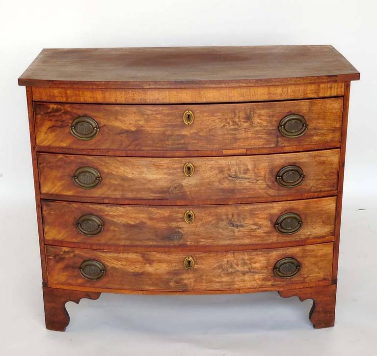 Massachusetts country Hepplewhite chest in cherry and mahogany. Great little rustic or formal piece. Original finish has been removed and in the past it has been oiled. It has a lovely glow which emphasizes the beautiful grain of the wood.
Interiors