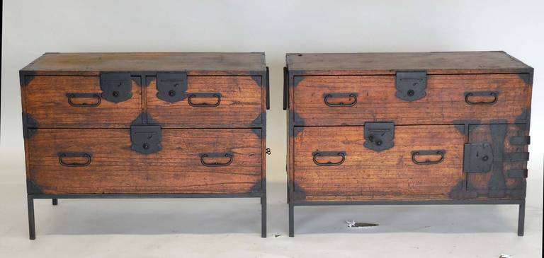 Pair of night stands on iron bases.  Chest on left has three drawers.  Chest on right has two large drawers and two small drawers within the small door on bottom right.  Beautiful patina and color.  All original. Functional and sturdy.