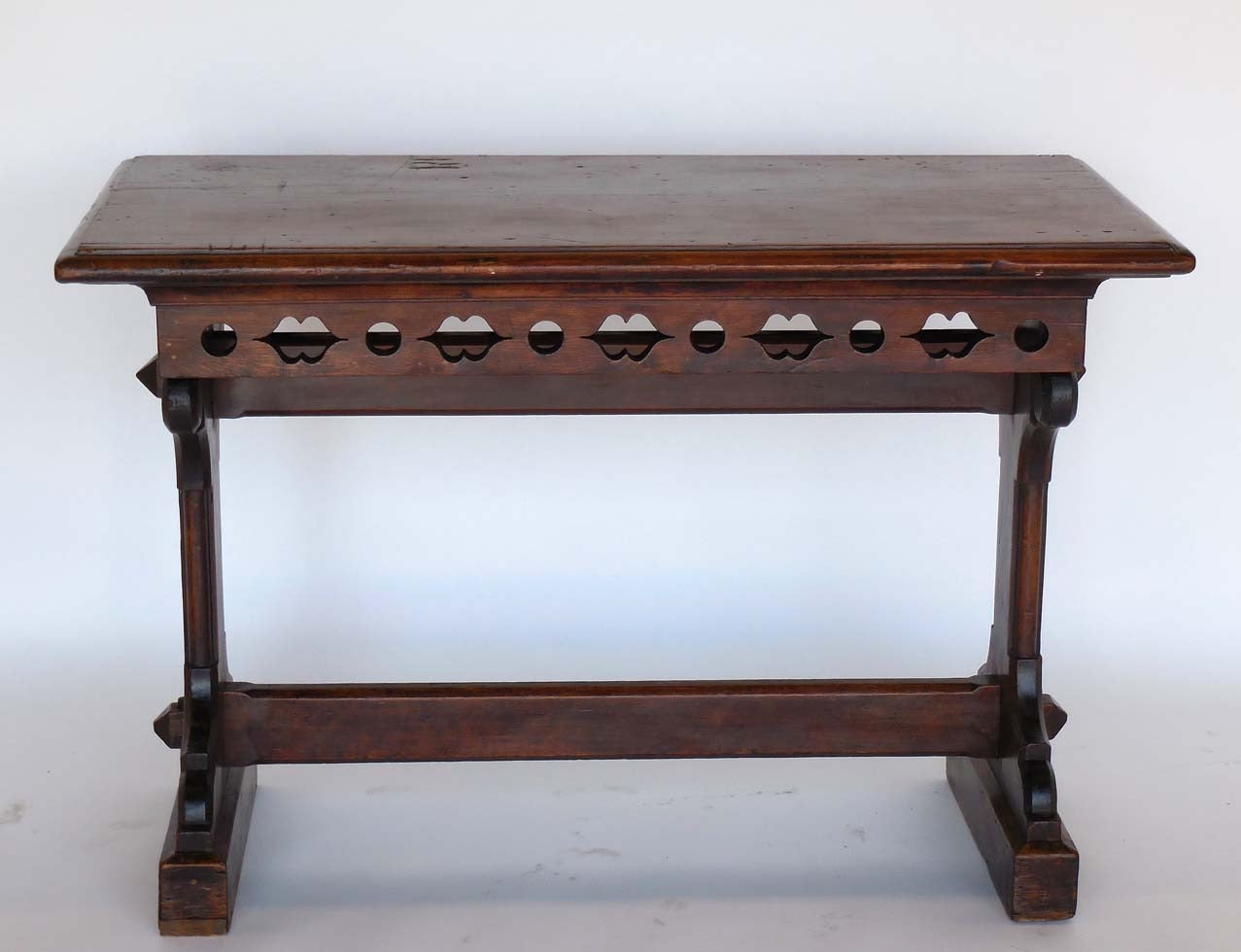 Fruitwood gothic revival altar table.  Late 19th century New England. Carving on both sides. Has the initials RF carved into the top.  Functional and sturdy with a nice patina.