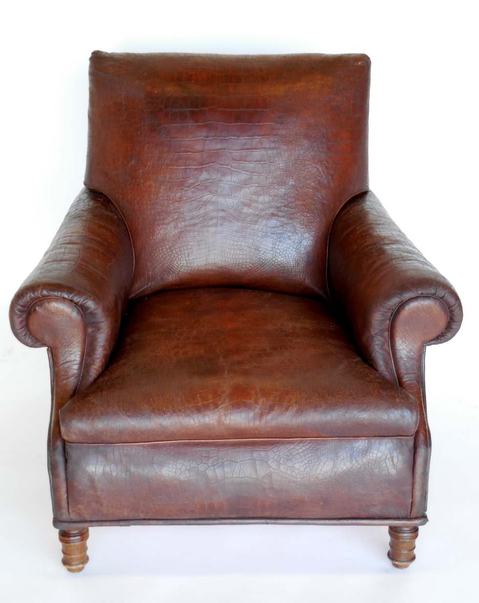 Early 20th c French embossed alligator pattern leather chair.  Very comfortable. It good condition for it's age. Lovely turned legs. Stuffed with horsehair. Refurbished.