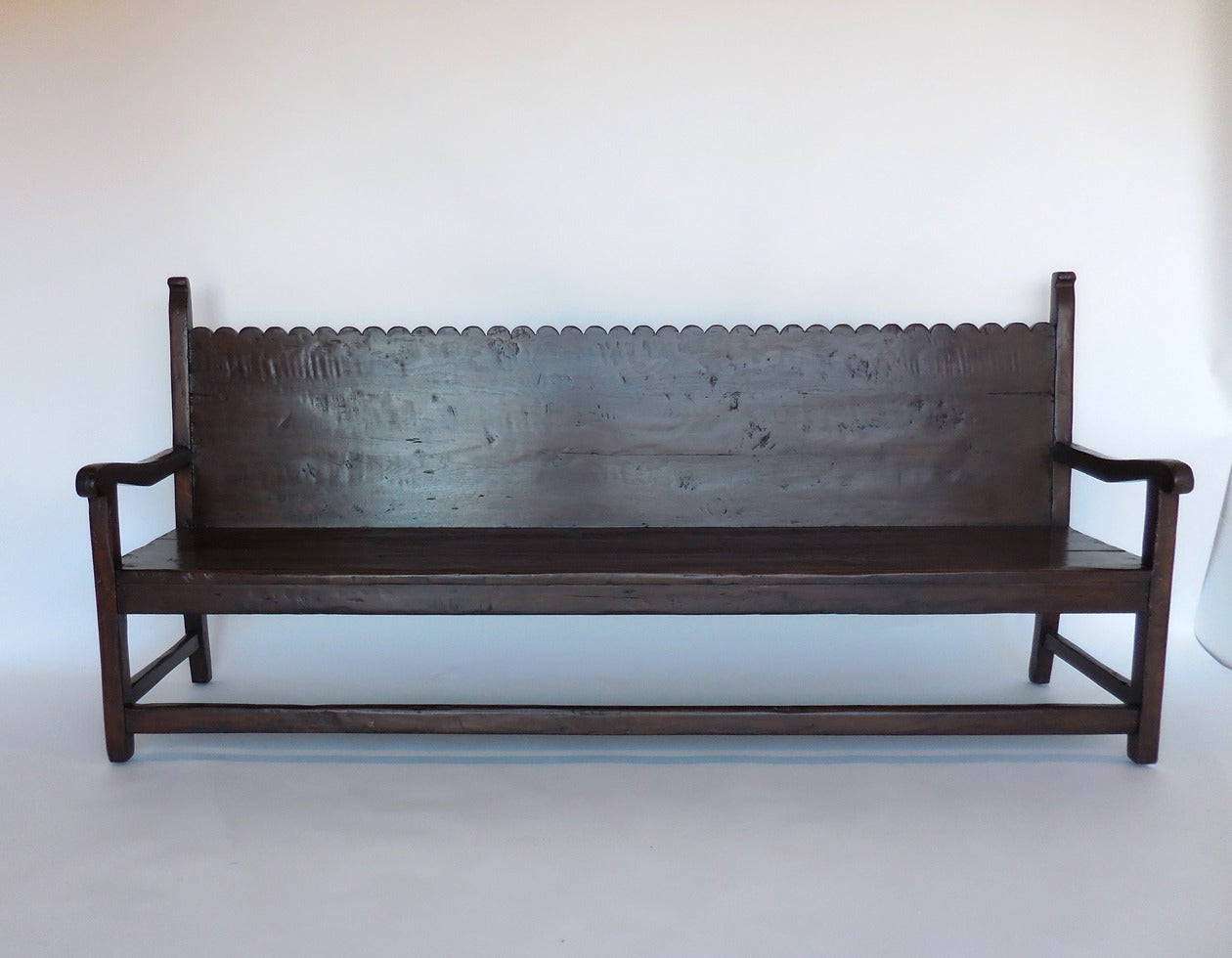 Custom walnut scalloped back bench. Can be made in a variety of woods and finishes. Classic colonial design. Made in LA by Dos Gallos Studio. Can be customized.
CUSTOM PRICES ARE SUBJECT TO CHANGE DUE TO FLUCTUATING WOOD  AND LABOR PRICES. PLEASE