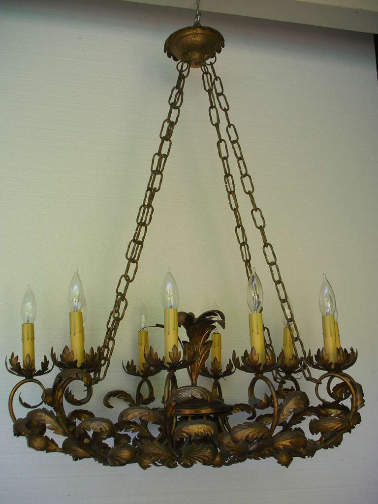 Large, oval gilt metal Italian chandelier with ten lights. A large 