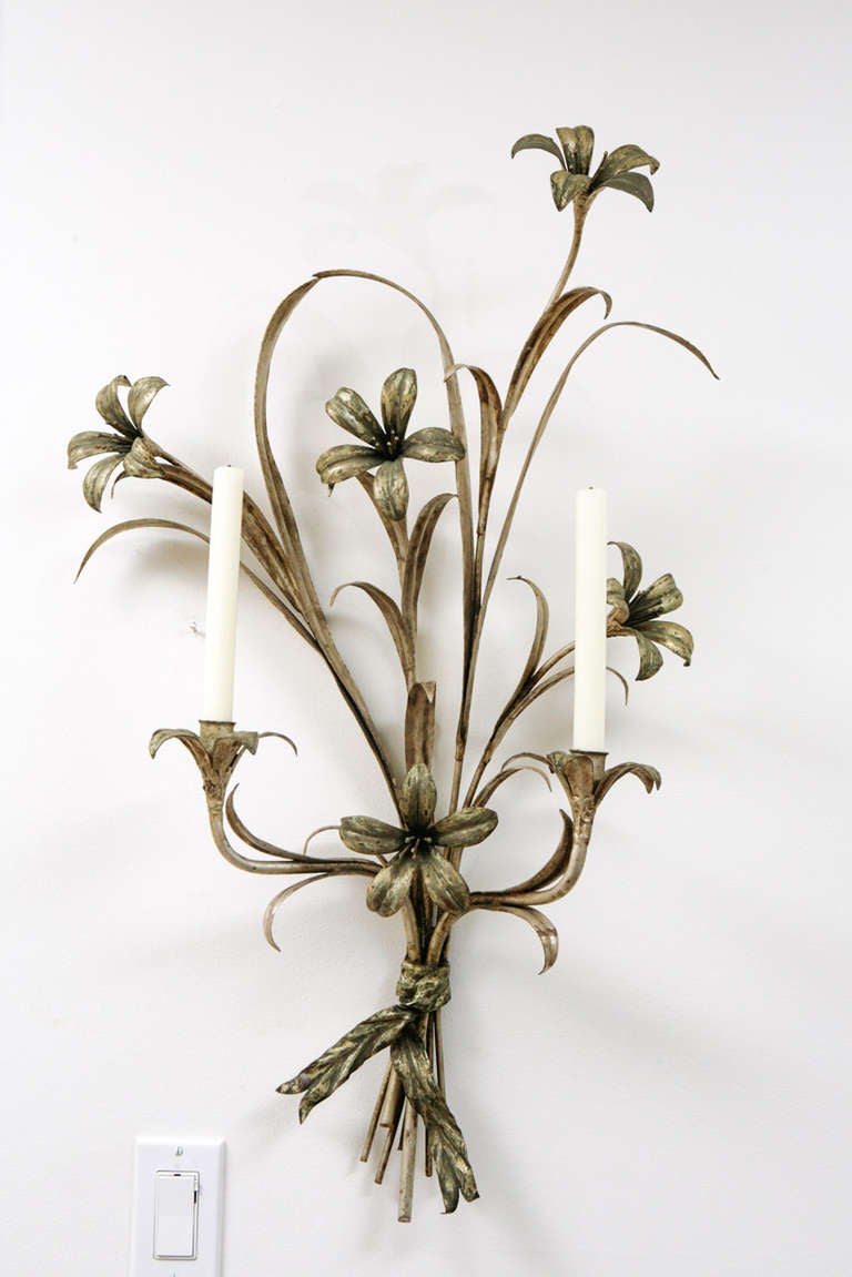 Single, large, mid century silver leaf, two light candle sconce. Lily bouquet floral design with a bow at the bottom to gather the stems.
Not electrified.
Previously priced at $950.00 now reduced to $550.00.
No further reductions.