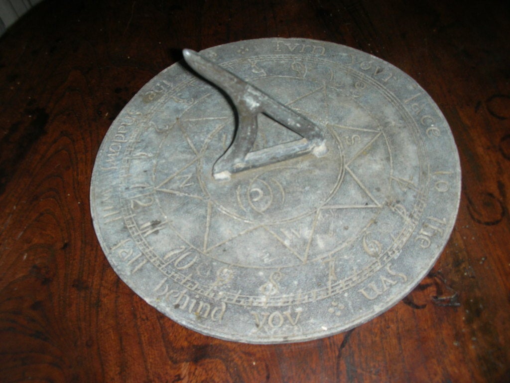 Hand etched and poured lead sundial with a cast lead gnomon.
Inscribed on the front with 
