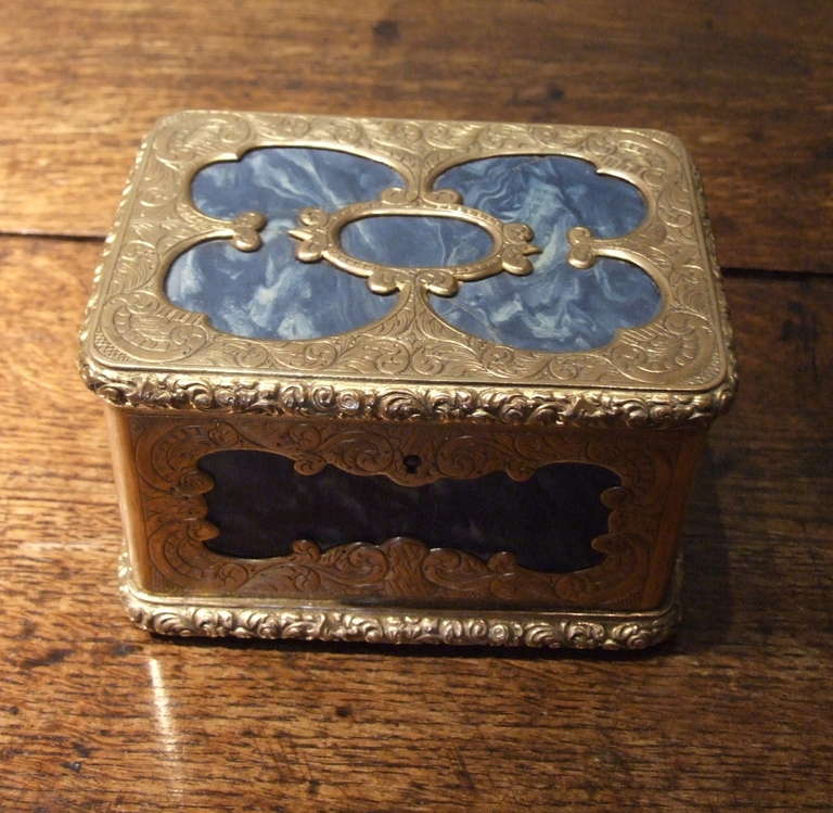 Lovely French 19th Century gilt brass mounted lapis lazuli box, the metalwork with etched and pierced design in the rococo taste, the molded edges with cast foliate decoration, the metal retaining much of its original fire gilt finish, one stone