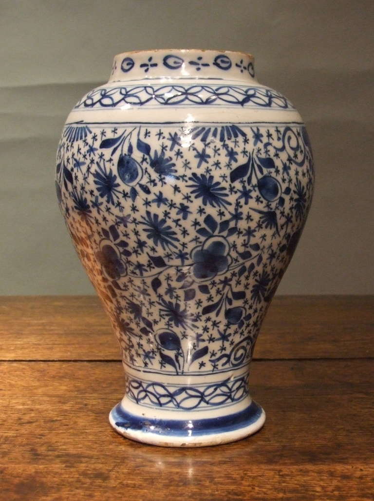 Good 18th Century Dutch delft balustrade form vase with floral decoration