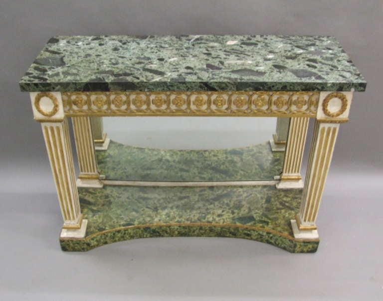Early 19th century, Italian neoclassical console table with veneered verde antique top, the base having original faux painted verde antique surface, the apron flower head and chain mail decoration, the legs capped with wreaths and egg and dart