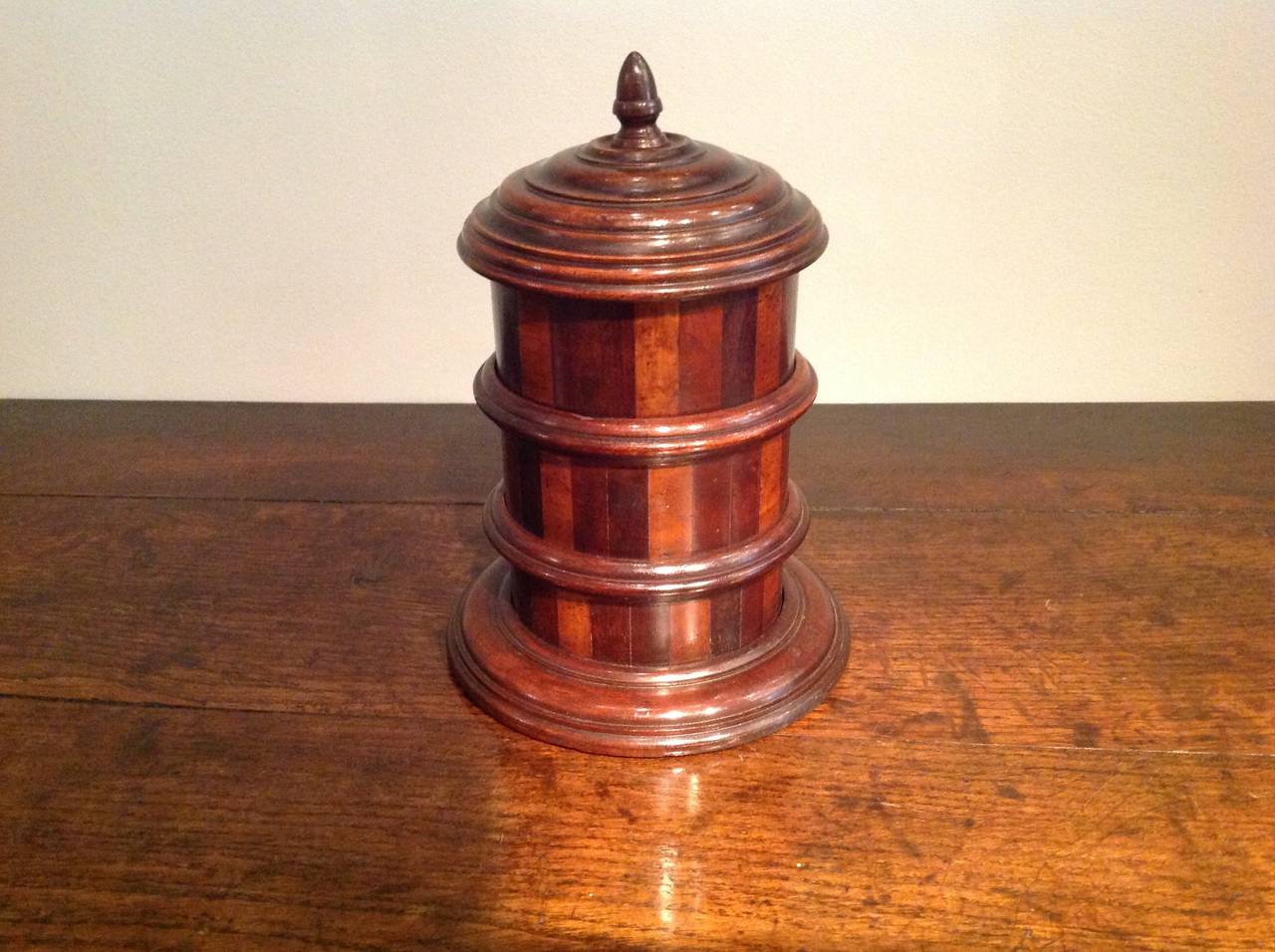 Fine Mid-19th century Scottish mixed wood turned storage container in alternating bands of mahogany, fruitwood and sycamore, with three stacking secoptions each with turned collars, the whole with excellent color.