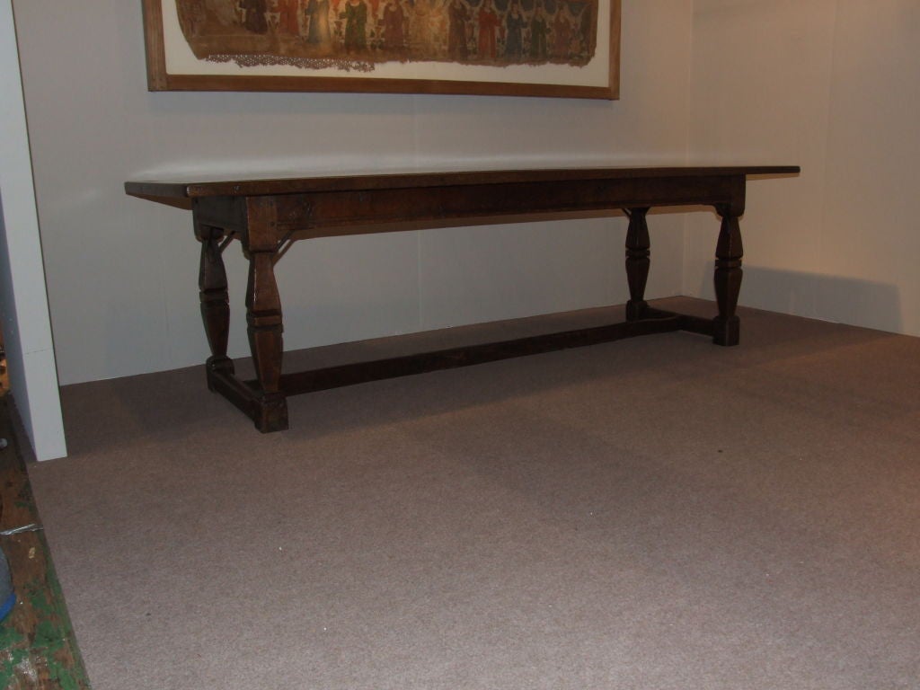 A fine 17th century English oak refectory table having two board top with edge moulding to all sides on square cut legs wtih tapering waists, joined by H-stretcher.  Circa 1650. Provenance: H.W. Keil from Egerton/Duke of Leeds family.