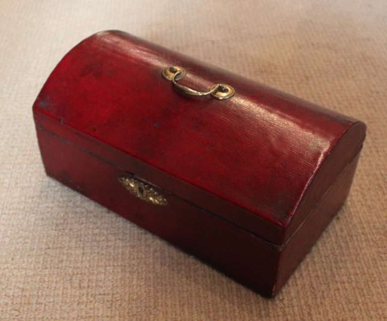 Fine late 18th Century English red grained leather document box with original brass handle and gilt brass escutcheon, original printed paper liner.