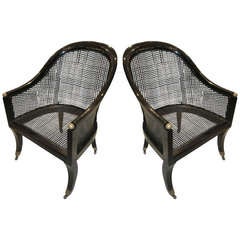Vintage A Pair Of Lacquered And Caned Tub Chairs On Brass Castors