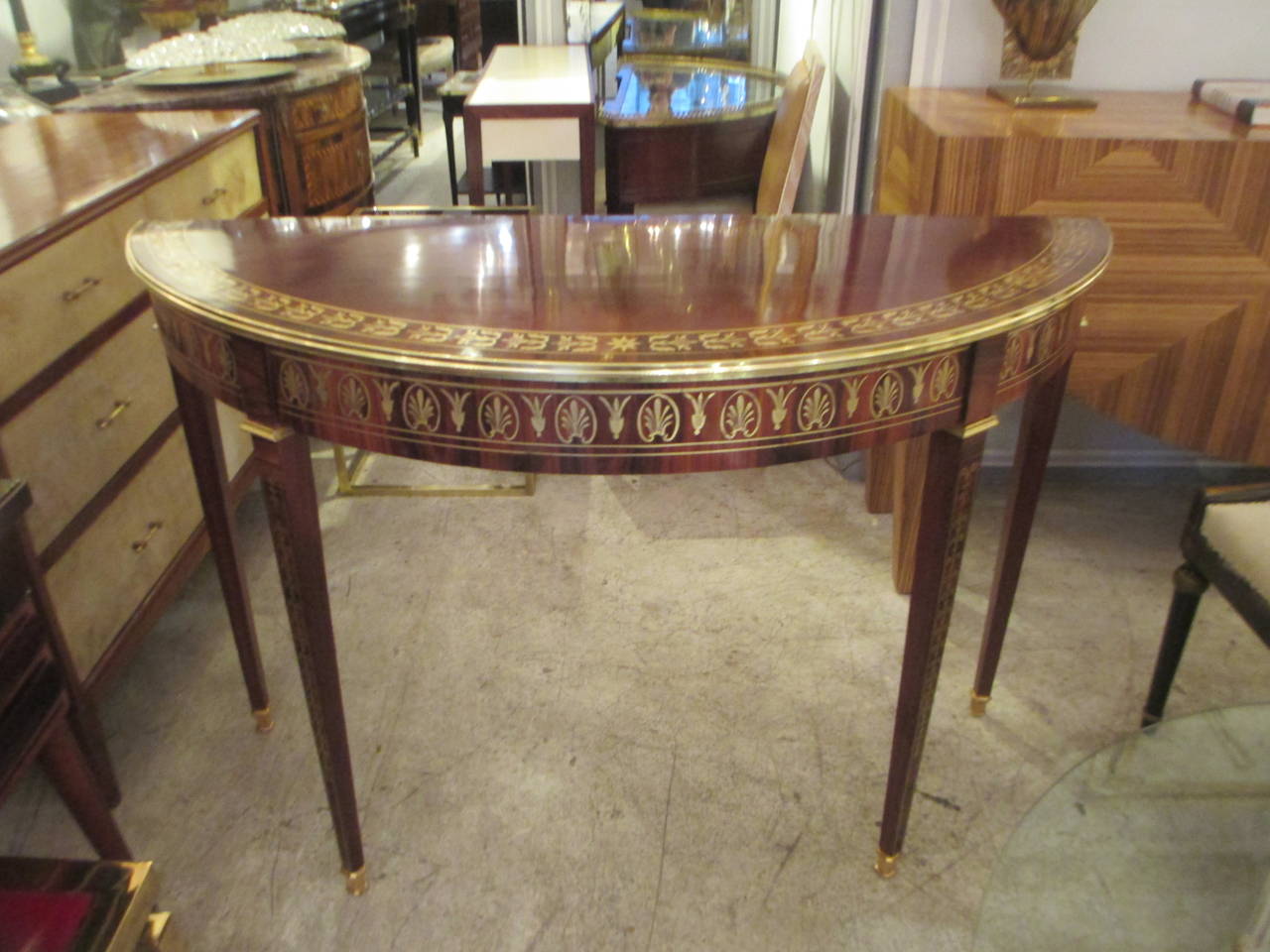 An exquisite Pair of  Regency style, Brass-Inlaid Rosewood  Demi-lune Consoles