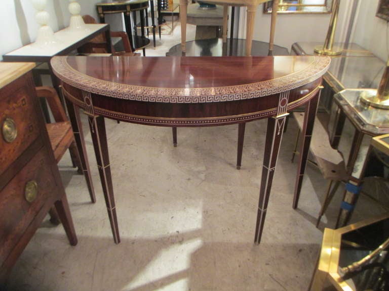 An Exquisite Pair of Inlaid and Brass Banded Rosewood Consoles