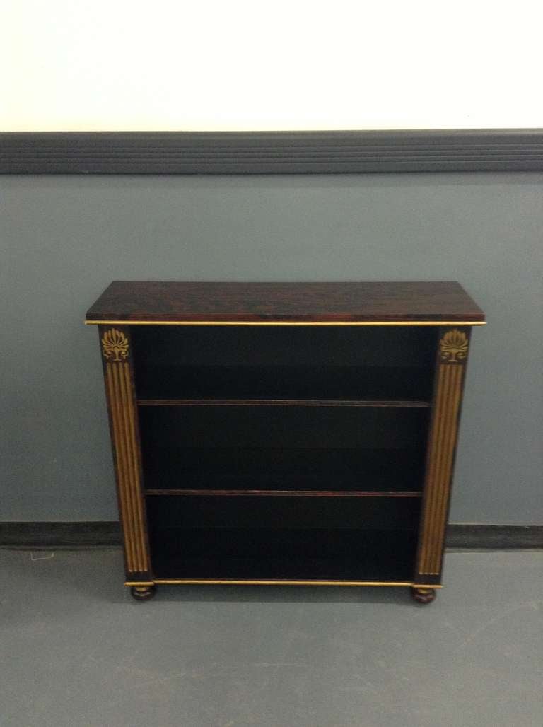 Faux rosewood and hand-painted bookcase in the Regency Manner