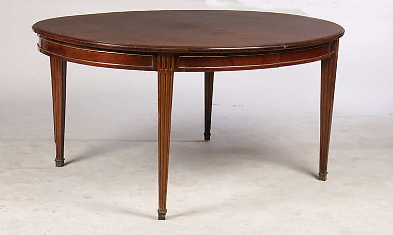 Mahogany Louis XVI Style Table on Tapered Legs, table has the capacity to extend to 11 1/2 ft. table has no extensions, additional extensions would need to be made, custom made extensions not included in price of table