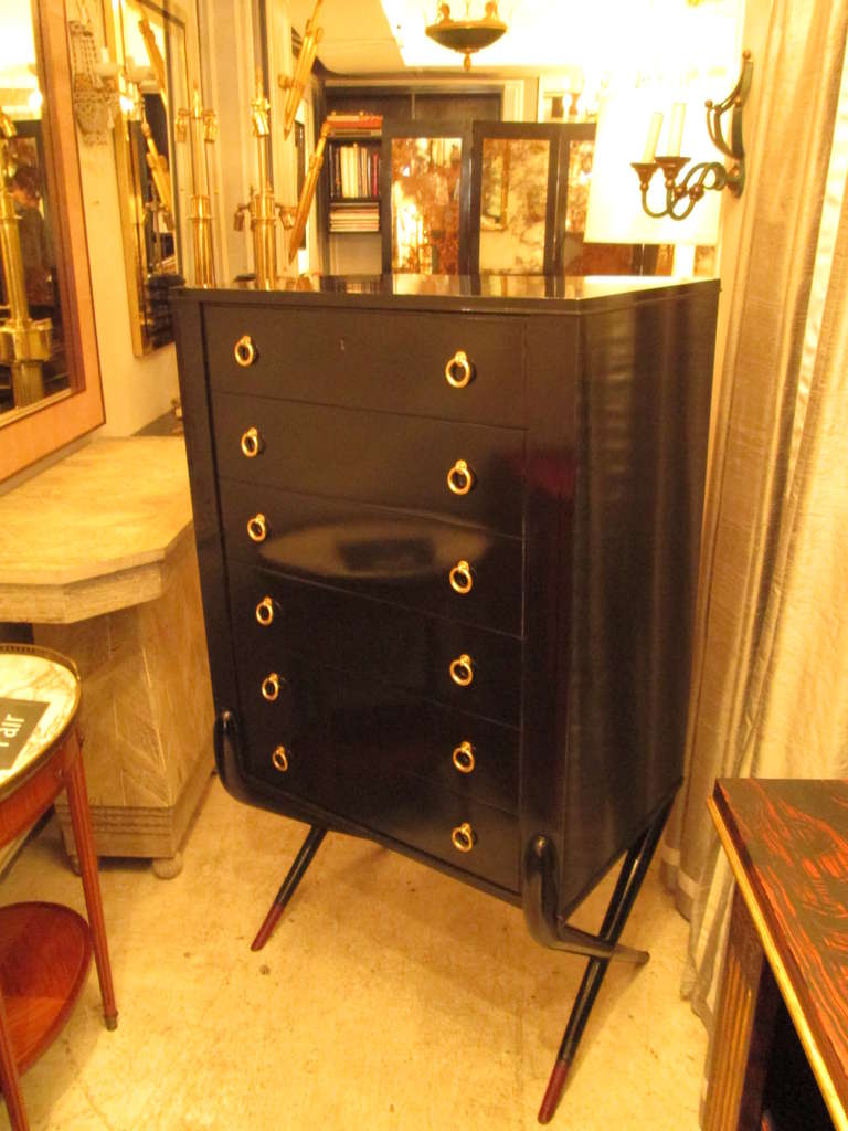 French 40's lacquered high chest, supported on criss-crossed legs with hand-stiched leather.