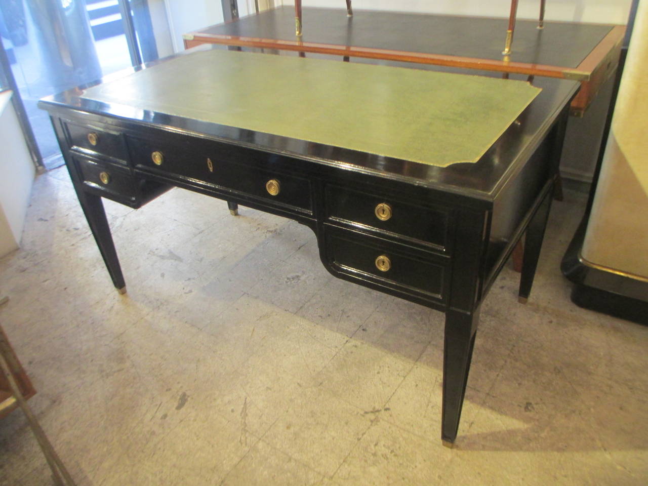 Directoire-Style Leather-top Bureau plat desk on Tapered legs ending in brass sabots, desk features 5 drawers