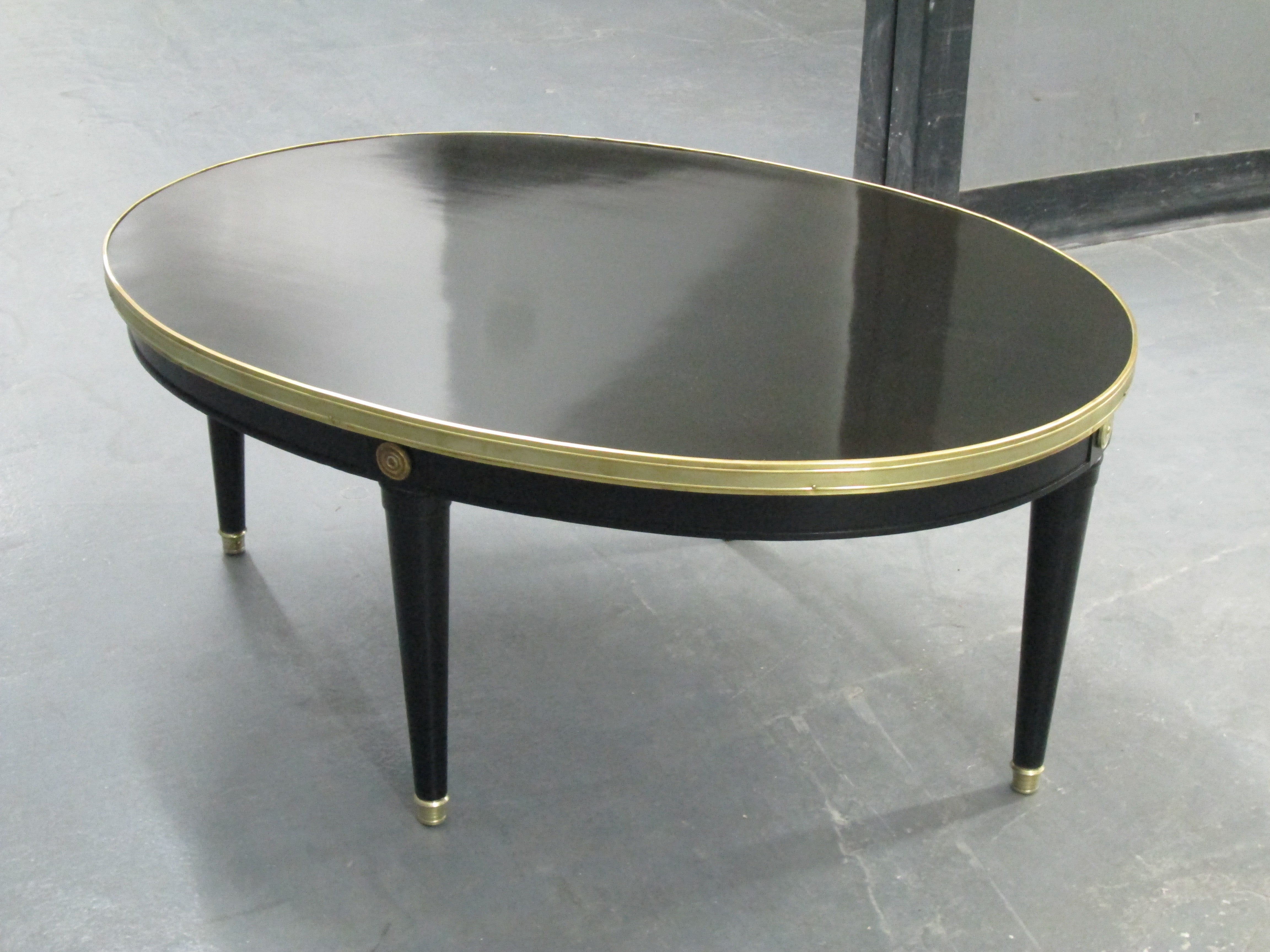 Oval Ebonized Coffee Table With Brass