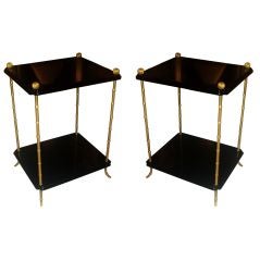 A pair ebonized two-tiered side tables on faux-bamboo legs