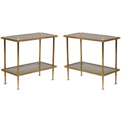 A Pair of two-tiered brass and smoked glass tables