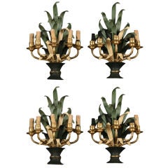 A set of four tole and brass 5 arm sconces