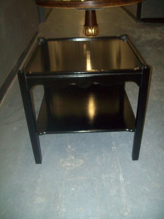 A pair of ebonized side tables/nightstands