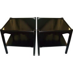 A pair of ebonized side tables/nightstands