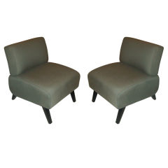 A pair of mid-century modern upholstered slipper chairs A pair of mid-century modern upholstered slipper chairs