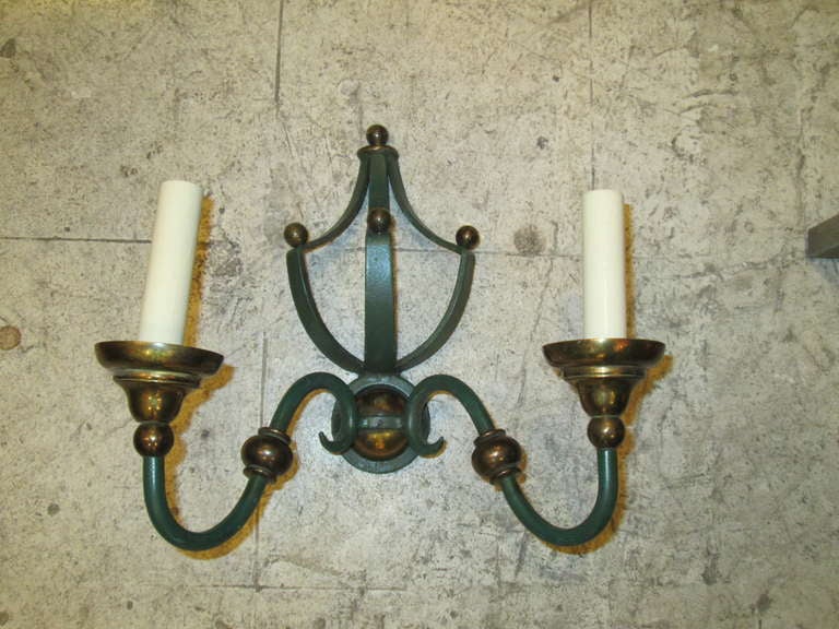 A Whimsical pair of painted iron and brass sconces