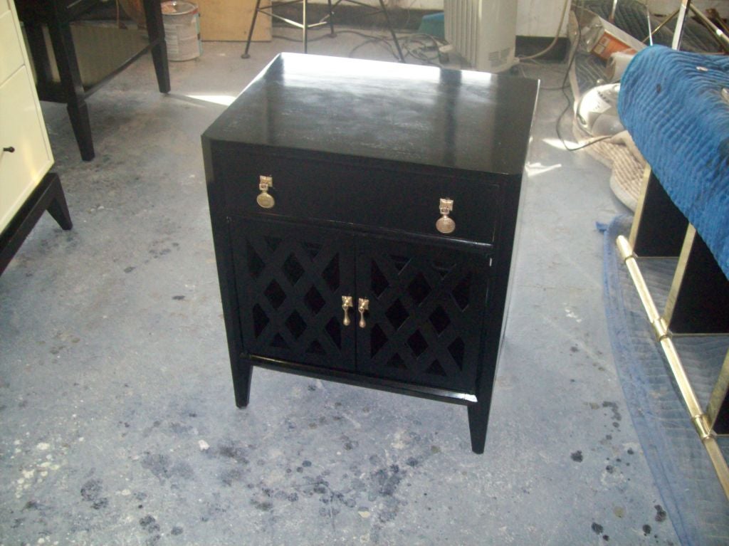 A pair of ebonized side tables/night stands with lattice work