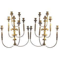 An oversized Pair of giltwood and silver-leafed Sconces