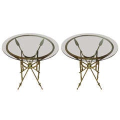 A Pair Of Brass Arrow Tables With Smoked Glass Tops