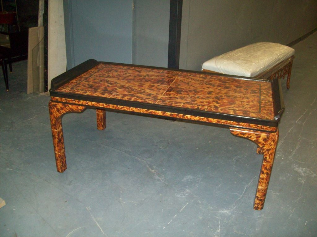 Lacquered faux-tortoise coffee table.