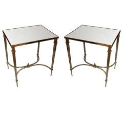 A pair of nickel-plated mirrored-top tables