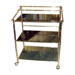 Faux-Bamboo Brass and Smoked Glass Bar cart