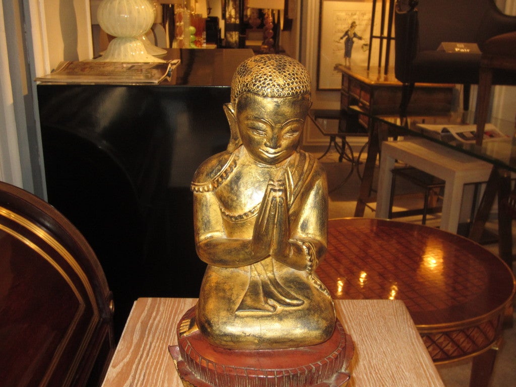 A pair of giltwood Quan Yin on stand.