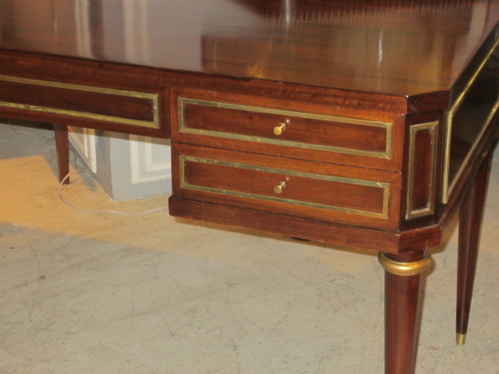 Exquisite rosewood and brass inlaid mid-century desk in the Directoire manner.

USA, 20th c